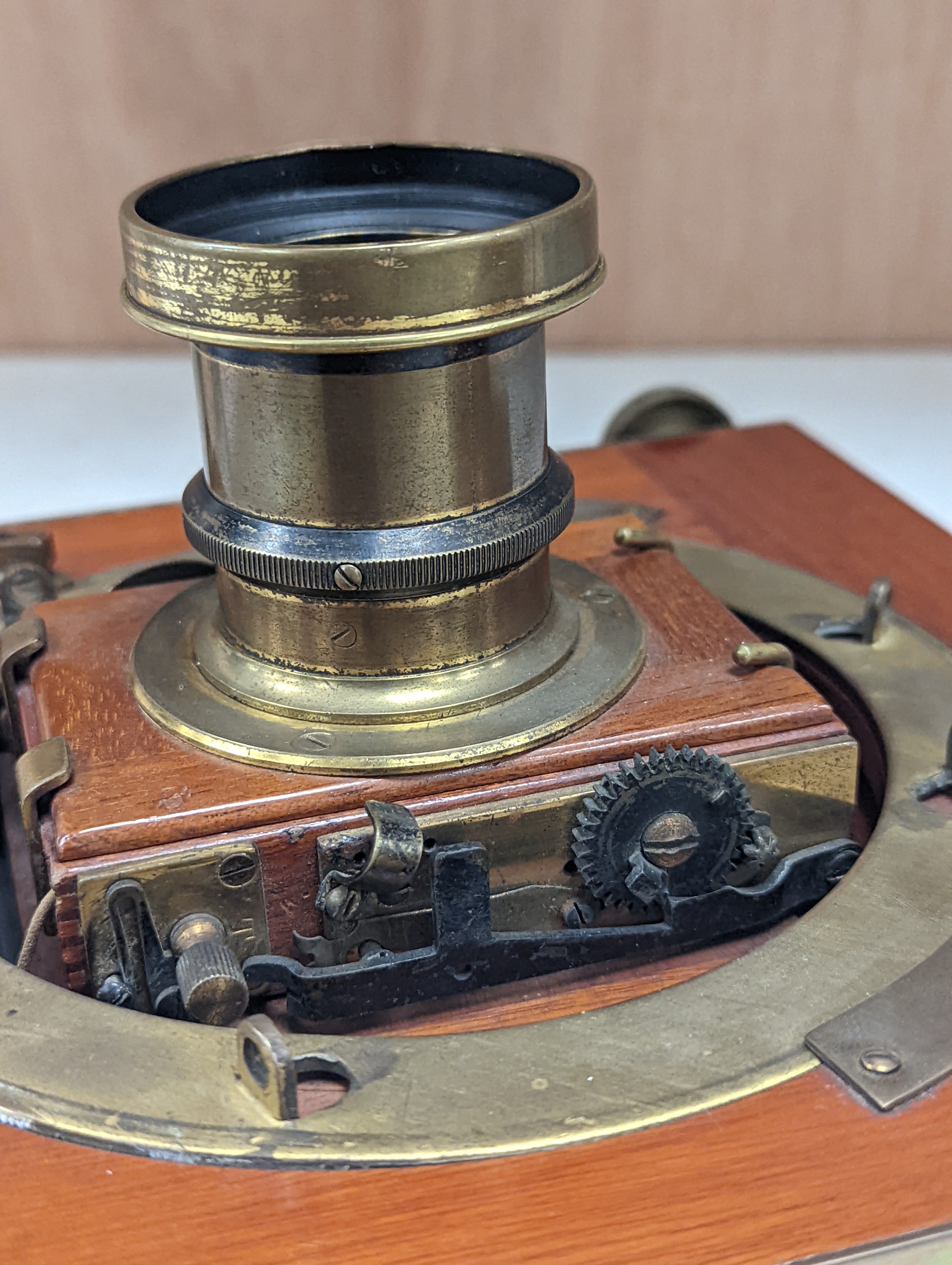 A Thornton Pickard mahogany and brass plate camera, three plates and a stand, 20cm sq.